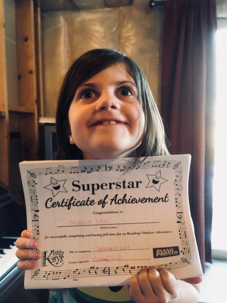 Maddie passed her first piano book!